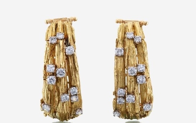 A pair of eighteen karat gold and diamond ear clips