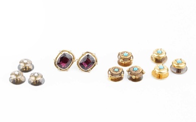 A pair of garnet ear studs, in unmarked yellow metal...