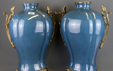 A pair of large continental ormolu mounted crackle glazed porcelain vases, H. 49.5cm.