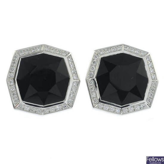 A pair of onyx and pavé-set diamond cufflinks.