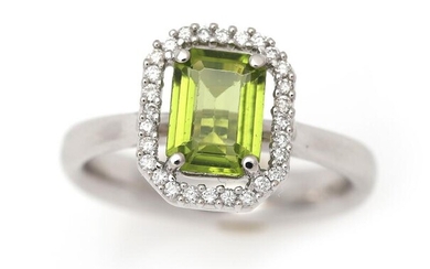 SOLD. A peridot ring set with a peridot encircled by numerous diamonds, mounted in 18k white gold. Size 55. – Bruun Rasmussen Auctioneers of Fine Art