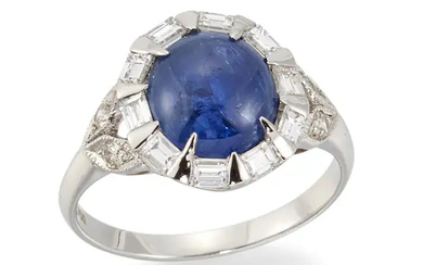A sapphire and diamond ring, of cluster design, with an oval cabochon...