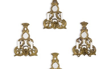 A set of four Edwardian gilt-metal and mirrored wall lights,...