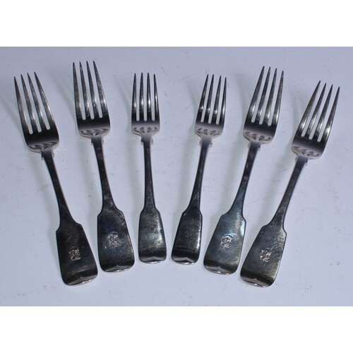 A set of four George IV Irish silver Fiddle pattern table fo...