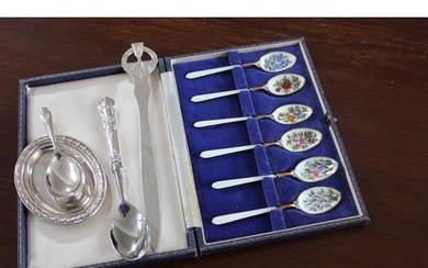 A set of six Elizabeth II silver gilt and enamelled tea spoo...