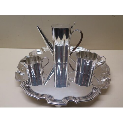 A silver plated tray, 31cm diameter, with a three piece plat...