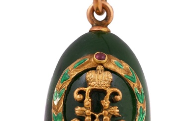 A small gold-mounted carved nephrite jade egg pendant was made between 1908 and 1917. Russian...