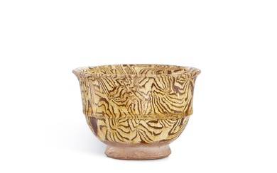 A yellow-glazed marbled cup, Tang dynasty 唐 黃釉絞胎弦紋盃