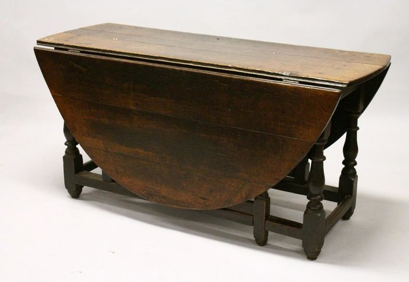 AN 18TH CENTURY OAK OVAL GATE-LEG DINING TABLE, with