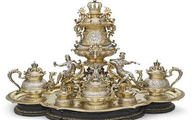 THE ROYAL WEDDING OF PRINCE WILHELM I I OF PRUSSIA AND PRINCESS AUGUSTE VICTORIA OF SCHLESWIG-HOLSTEIN: AN IMPORTANT PARCEL-GILT SILVER AND ENAMEL SIX-PIECE TEA SERVICE ON FITTED STAND MADE BY ROBERT MAIERHEIM FOR GEBREDER FRIEDLANDER, BERLIN, 1881...