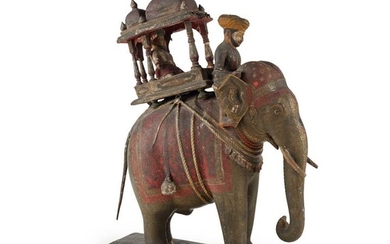 AN INDIAN CARVED AND PAINTED WOOD AND GESSO MODEL OF AN ELEPHANT AND HOWDAH 19TH CENTURY
