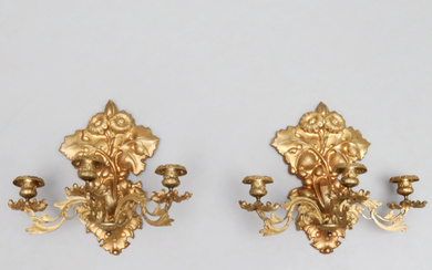 APPLIQUER, a pair, neo-rococo, bronzed metal, three light arms each, decor of leaves and flowers.