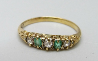 An 18ct gold, emerald and diamond seven stone ring, 2g, J