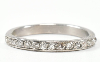 An 18ct white gold and diamond half eternity ring. The half ...