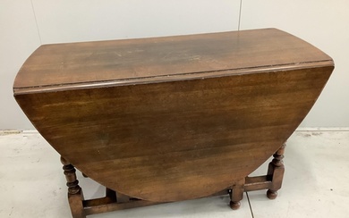An 18th century style oak gateleg dining table, 170cm extend...