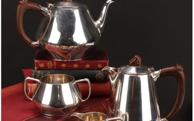 An Art Deco style silver four piece tea service, comprising ...