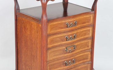 An Edwardian mahogany and satinwood crossbanded five-drawer music chest with a raised top and open s