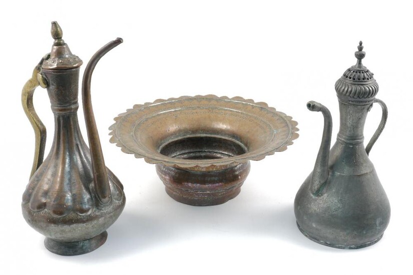 An Islamic copper jug and associated basin,...