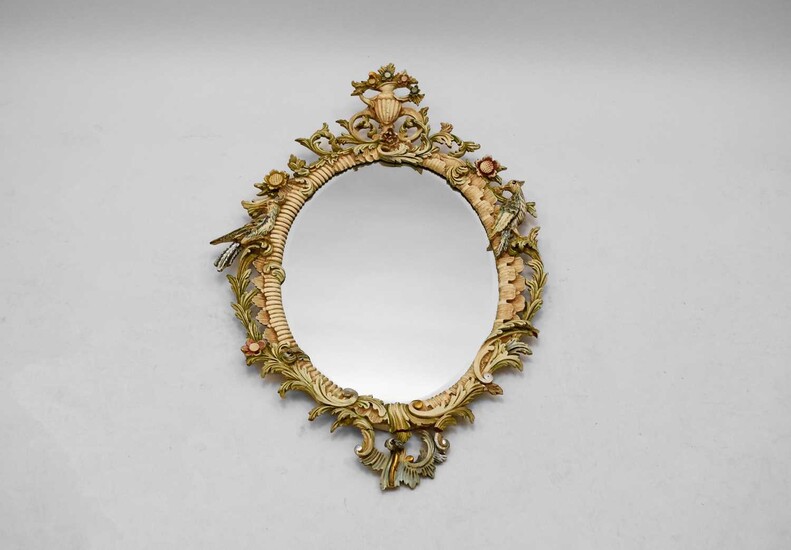 An Italian carved and painted wood rococo style wall mirror