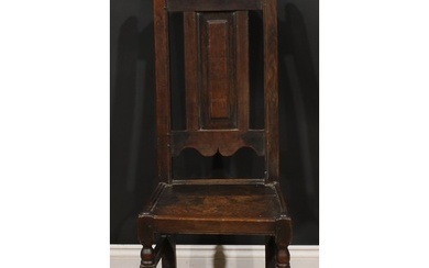 An early 18th century oak side chair, shaped cresting rail, ...