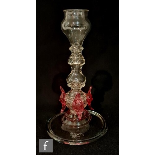 An early 20th Century clear crystal glass candlestick in the...