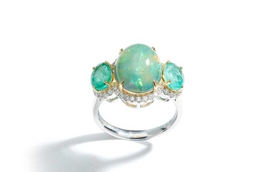 An opal, emerald and diamond three-stone ring