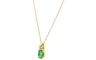 BRILLIANT CUT DIAMOND AND EMERALD PENDANT. WITH 18K YELLOW GOLD CHAIN AND FRAME. BRAND NEW.