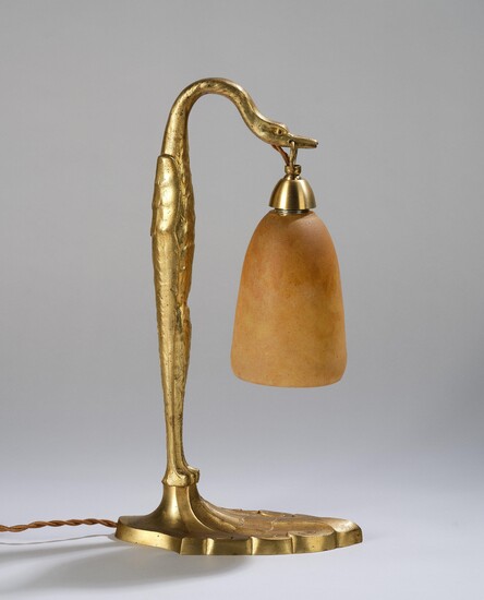 C. Ranc, a gilt bronze table lamp with a swan and a lamp shade by Daum, Nancy, c. 1925