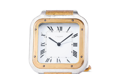 Cartier. A stainless steel and gilt brass quartz desk clock...