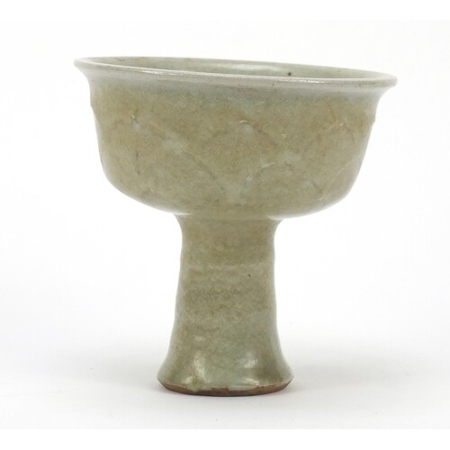 Chinese porcelain lotus leaf stem cup having a celadon glaze...