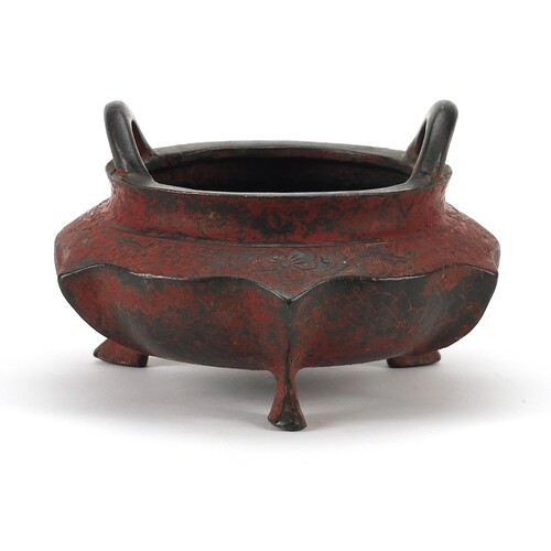 Chinese red painted bronze tripod censer with twin handles, ...