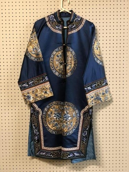 Chinese silk embroidery woman dress.
