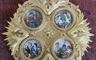 Circular gilt wall plaque inset with four porcelain panels...