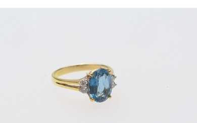 Diamond and blue zircon dress ring, the central oval cut sto...