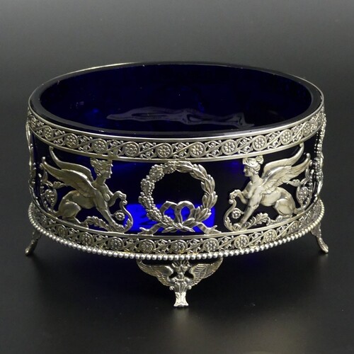 Edwardian ornate pierced silver bon bon dish with a blue gla...