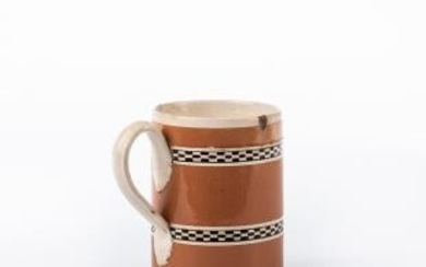 Engine-turned and Slip-decorated Creamware Half-pint Mug
