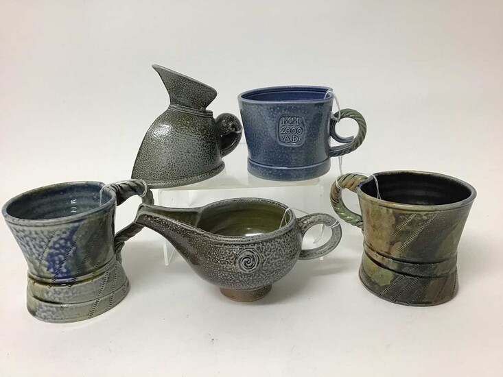 Five salt glazed studio pottery items including Mark Compton jug, 11cm high, two Jane Hamlyn mugs, both 9cm high, another 7.5cm high and Mike Todd jug, 7cm high