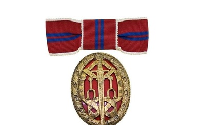 Garrard & Co - A silver gilt Knight Bachelor's breast badge and coronation ribbon, oval shaped with