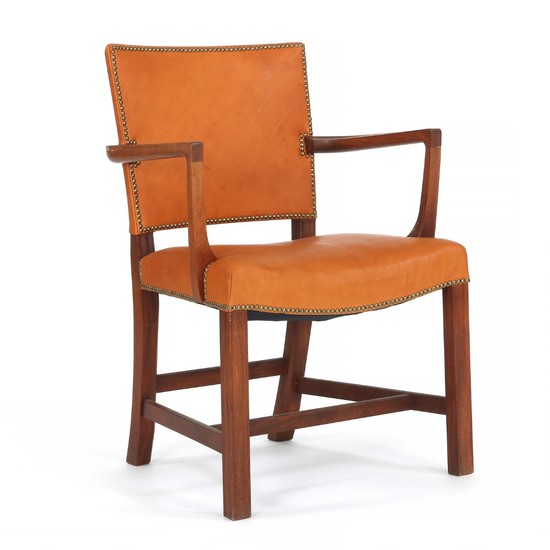 Kaare Klint: “The Red Chair”. Armchair with profiled mahogany frame. Seat and back upholstered with brown leather, fitted with brass nails.