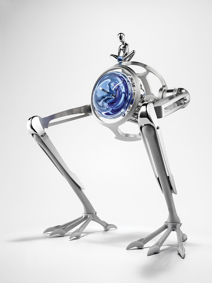 MB&F + L'ÉPÉE TOM & T-REX ‘Tom & T-Rex’ is a table clock conceived by MB and manufactured by L’Epée. It tells the story of a child struck by illness, Tom, who goes on an adventure with his formidable companion, T-Rex.