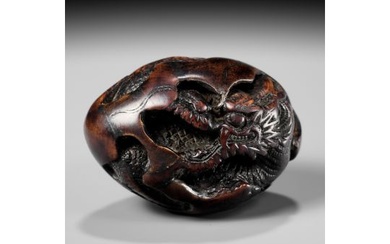 NAITO TOYOMASA: A FINE WOOD NETSUKE OF A DRAGON EMERGING FROM AN EGG