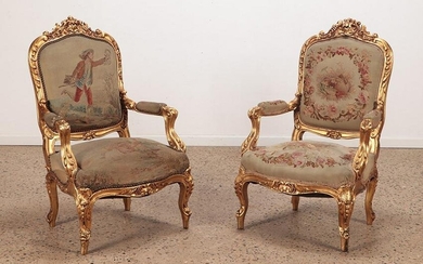 PAIR LOUIS XV STYLE GILTWOOD OPEN ARM CHAIRS WITH DEEP RELIEF CARVINGS C 1910.