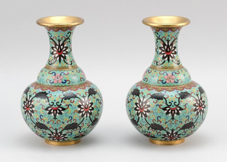PAIR OF CHINESE CLOISONNÉ ENAMEL VASES In baluster form, with gilt mouths and feet and floral and vine decoration on a celadon green...