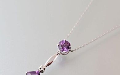 Pendant and its chain in white gold 750 thousandths, the pendant presents in fall two amethyst one square cut, the other round intercalated with a modern cut diamond.