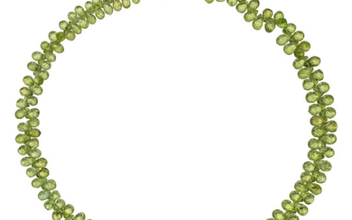 Peridot, Diamond, Gold Necklace The necklace is composed of...