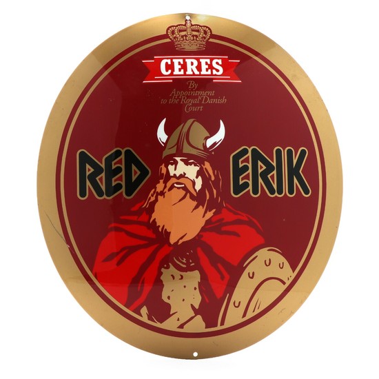 “Red Erik” from Ceres Brewery. Oval metal commercial sign decorated in red and gold. 21st century. H. 39 cm. W. 34 cm.