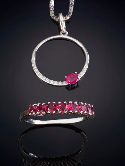 SET OF HALF A WEDDING RING OF SEVEN RUBIES AND A PENDANT DECORATED WITH SMALL DIAMONDS AND A RUBY. Mounting in 18k white gold. Price: 400,00 Euros. (66.554 Ptas.)