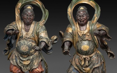 SUITE DEUX STATUETTES DE FUDO MIYO (GARDIEN DU CIEL) en bois laqué et doré, représentés en pied, les visages courroucés aux ye...