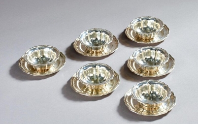Set of 6 silver cups and their saucers with contoured edges.