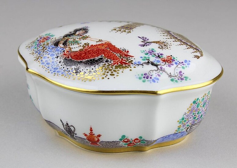 Small lidded box 1001 Nights, Meissen 2nd half of the 20th century, designed by Prof. Heinz Werner, curved ovoid form, h: 4,2 cm, l: 10 cm, polychrome painted with a harem lady, animals etc., decorated with gold, blue sword mark and embossing on the...